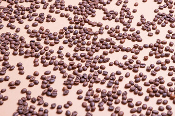 
Top view background of aromatic brown coffee beans scattered on surface
