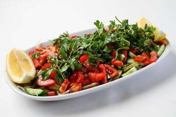 Turkish kebab salad mixed salad plate. onion, tomato, pepper, parsley and spices