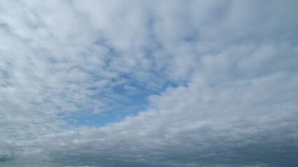 Colorful morning sky with cirrocumulus clouds. Beautiful sunny blue sky with cirrocumulus clouds....