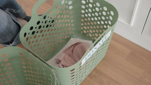 Young adult woman asia people arrange stack undies sale manage used old bra bank neat basket box clean house closet eco care. Happy asian smile go green wife home chores net zero waste fabric issue.