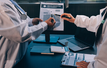 Medical team working on digital tablet healthcare doctor technology tablet using computer analyzed the results of medical reports at the hospital.