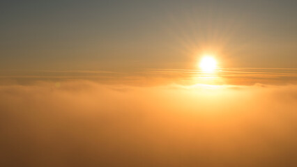 Sunset in the Teplice-Adršpašské rocks. The sun is low on the horizon and the inverted clouds...