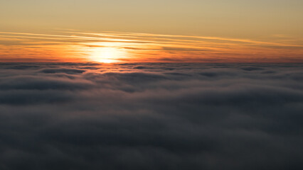 Sunset in the Teplice-Adršpašské rocks. The sun is low on the horizon and the inverted clouds...