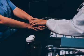Kind male doctor wearing white coat consulting elder senior female patient holding hand of older woman giving help, safety, empathy and support, showing care and compassion concept. Close up view