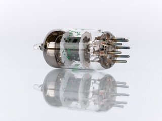 Close-up view from the side of 7-Pin vacuum tube contacts isolated on white background with...