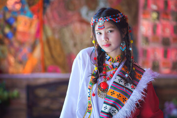 Portrait Fashion of the Asian Tourist young girl wearing traditional Tibetan clothing costume...