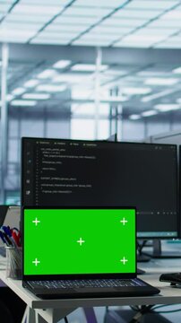 Diverse team of developers in server hub using green screen laptop, looking for misconfigurations. African american IT experts mending data center bugs with chroma key notebook, camera B