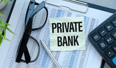PRIVATE BANK text with calculator, glasses and pen on the chart background