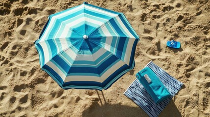 A top-down view of a beach umbrella set up on the sand, with a beach towel and a cooler nearby. The focus is on the umbrella's colors and design.