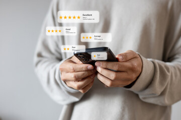 close up young man and hold smartphone and read review online website page about service and...
