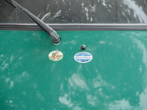 Green Ape piaggio cargo van scooter car hood detail showing moto bosi and turtle stickers