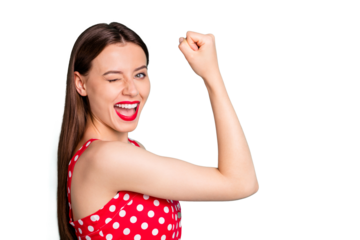 Close up photo of cheerful lady winking blinking her eyes raising fists screaming yeah wearign polka dot dress isolated over green teal turquoise background