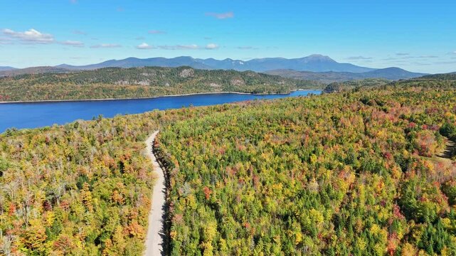 USA, Maine, Greenville, Millinocket, aerial view of Northern Woods area during Fall, including the 'Golden Road', Ripogenus Lake and Dam, and Mount Katadhin in the distance.