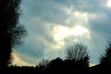 Fototapeta premium Sun Beams Ray Down Onto The Landscape Below
