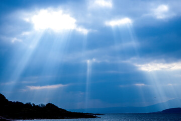 Sun Beams Ray Down Onto The Landscape Below