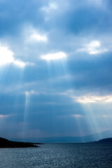 Sun Beams Ray Down Onto The Landscape Below