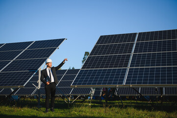 Solar panels. Engineer man on solar power station