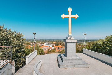 view of religious cross over Sremski Karlovci town, showcasing its charming architecture, historic buildings, and the prominent cathedral, Serbia