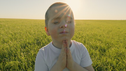 Child Boy Praying. Religion And God. Young Gratitude A God Religion Concept. Boy Is Dreaming. Happy...