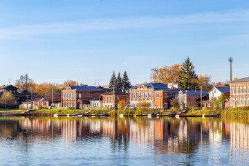 Fototapeta premium Bogorodsk, Nizhny Novgorod region, Russia, Street view of an ancient provincial Russian city on the shore of a lake on a summer evening. An ancient building of artisans, an architectural monument.