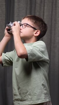 vertical video boy photographer capturing memories vintage rangefinder camera