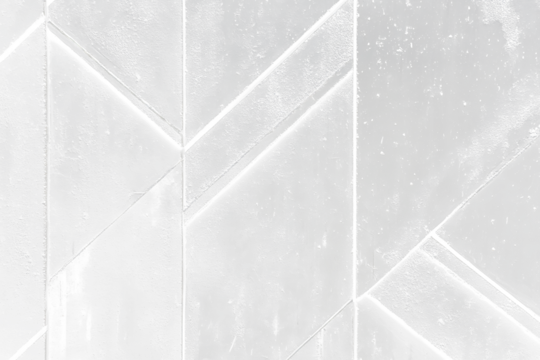 Geometric black textured wall with a repeating pattern of triangular shapes.