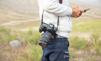 Photographer with a professional camera in nature.