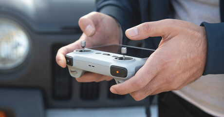 Caucasian man using drone controller.