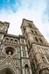 Fototapeta premium Florence Cathedral facade - Duomo di Firenze. Beautiful religious building with cloudy sky