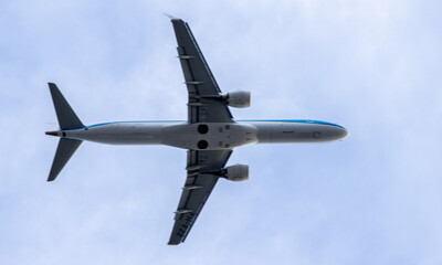 A Large Passenger Aircraft Passing Overhead