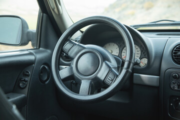 View of car with the steering wheel.
