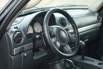 View of car with the steering wheel.