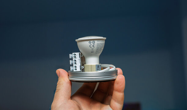 Paris, France - Oct 11, 2020: A close-up view of a Philips Hue GU10 lamp equipped with Zigbee technology, showcasing its design and connectivity features for smart home integration