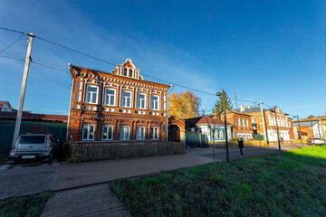 Naklejka premium Bogorodsk, Nizhny Novgorod region, Russia, Street view of an ancient provincial Russian city on the shore of a lake on a summer evening. An ancient building of artisans, an architectural monument.