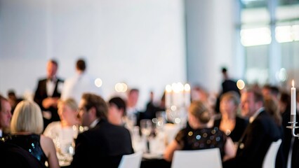 An elegant blur depicting a charity gala, with guests dressed in formal attire and enjoying the event.

