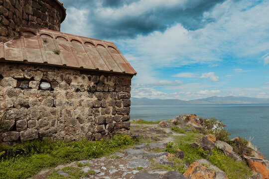 Sevanavank Monastery overlooking Lake Sevan on a bright cloudy day in Armenia