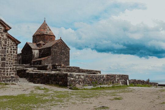 Sevanavank Monastery with ancient architecture set against a dramatic sky in Armenia