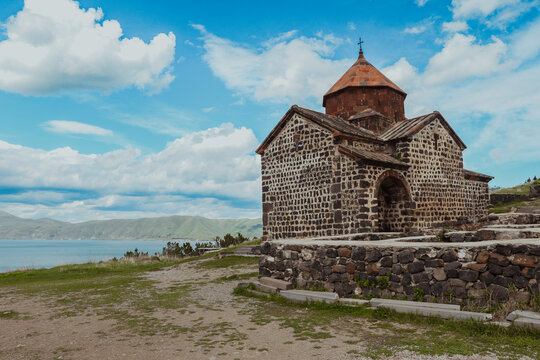 Historic Sevanavank Monastery overlooking Lake Sevan in Armenia under a vibrant sky