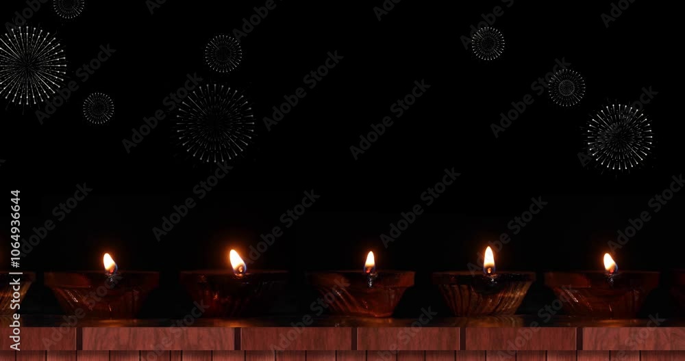 Poster row of glowing oil lamps on table with colorful animated fireworks flashing in dark background above