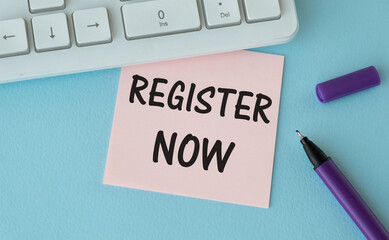 Membership concept. Template for registration. Register now hand lettering iconon word desk with glasses, coffee, plant on dark wooden background top view space for text