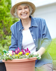 Gardening, flowers and portrait with elderly woman outdoor with plants, bushes and yard for retirement hobby. Spring, zen and smile with senior person for landscaping, botany and happy at home