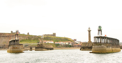 Whitby Harbour Pier Walls Offer The Entrance And Exit To Boats Of All Sorts