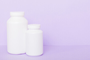 supplement pills with medicine bottle health care and medical top view. Vitamin tablets. Top view mockup bottle for pills and vitamins with green leaves, natural organic bio supplement, copy space