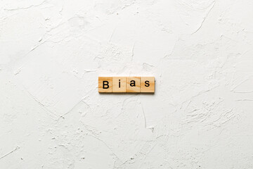 BIAS word written on wood block. BIAS text on cement table for your desing, concept