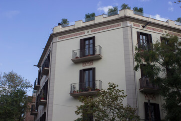 house with arched windows and painted walls and beautiful balconies.