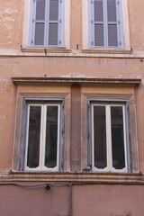 old window with shutters in the centre of Rome