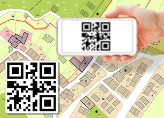 Imaginary cadastral map of territory and General Urban Plan with buildings and land parcel - Land and property registry and real estate property concept with smart phone and totally invented QR code