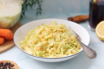 A bowl with coleslow salad