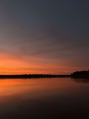 Obraz premium Sunset over a lake 