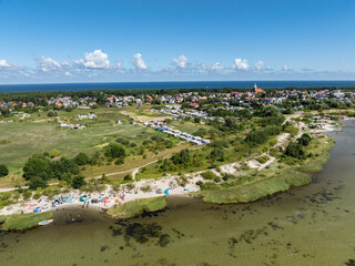 People swim on the sea on a kiteboard or kitesurfing. Kitesurfing lessons on the bay. Summer sport...